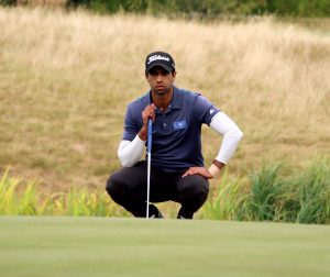 Aaron Rai on the green