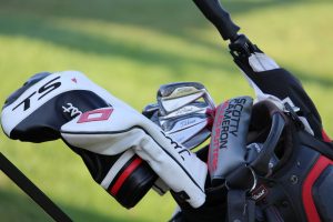 A golf bag with golf clubs